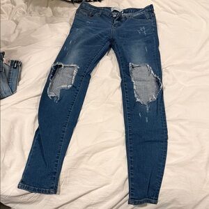 Distressed denim jeans